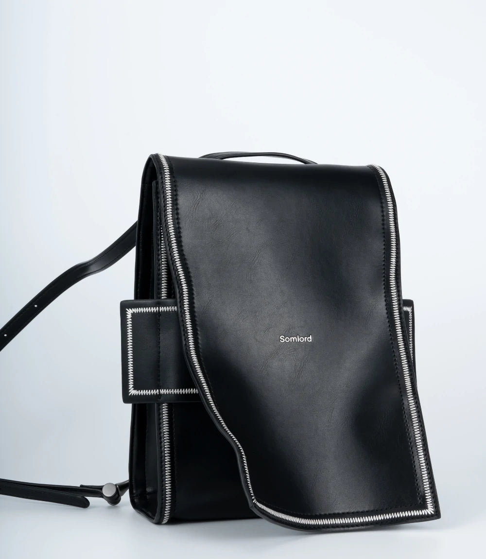 Modern black leather mini backpack – a perfect blend of structure and softness for urban minimalism.