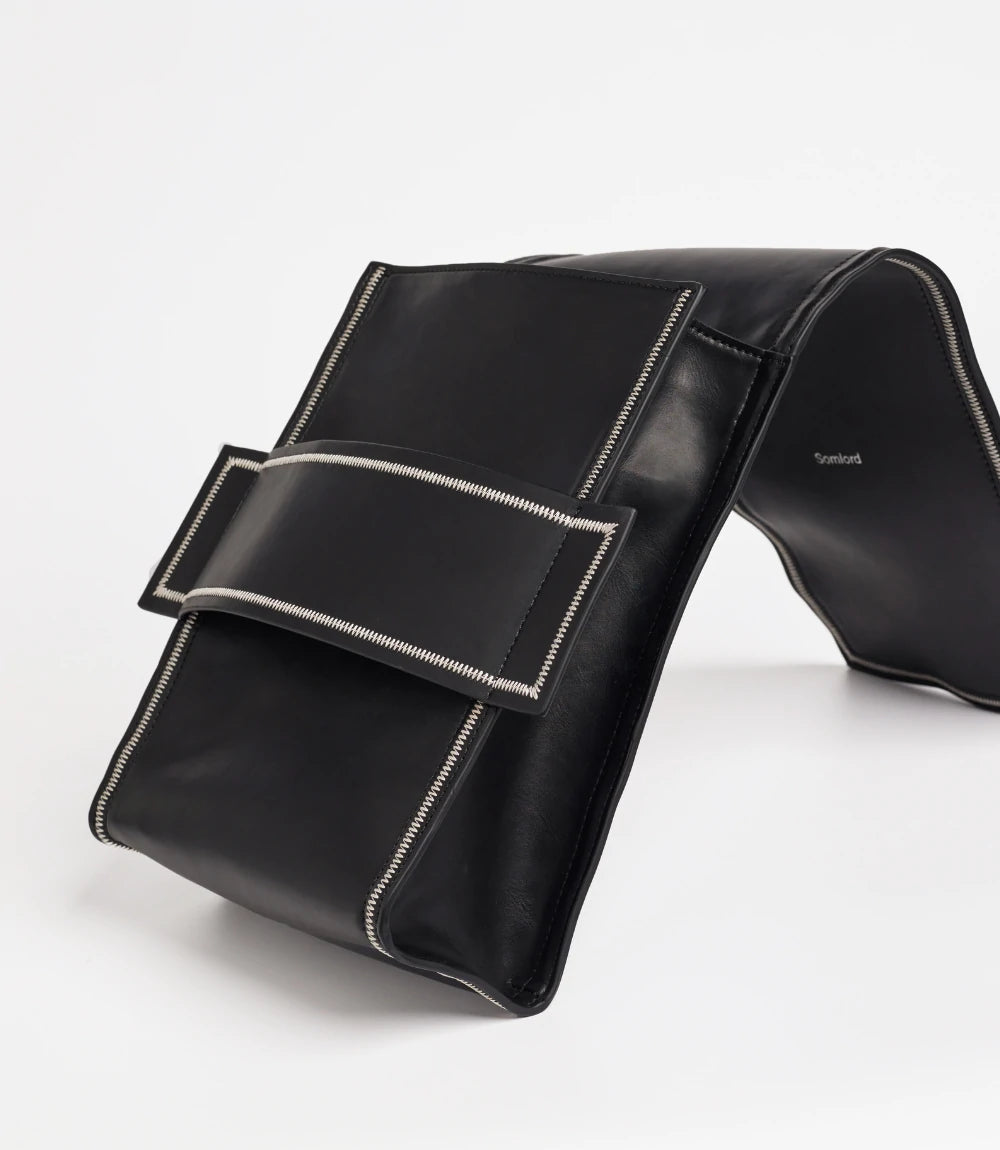 Flexible leather design – soft yet structured convertible backpack with a unique fold-over closure.