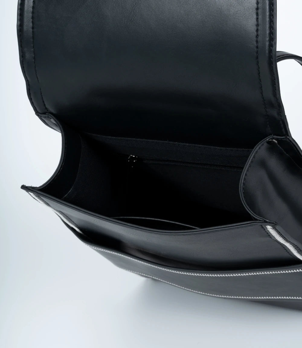 Modern black leather mini backpack – a perfect blend of structure and softness for urban minimalism.