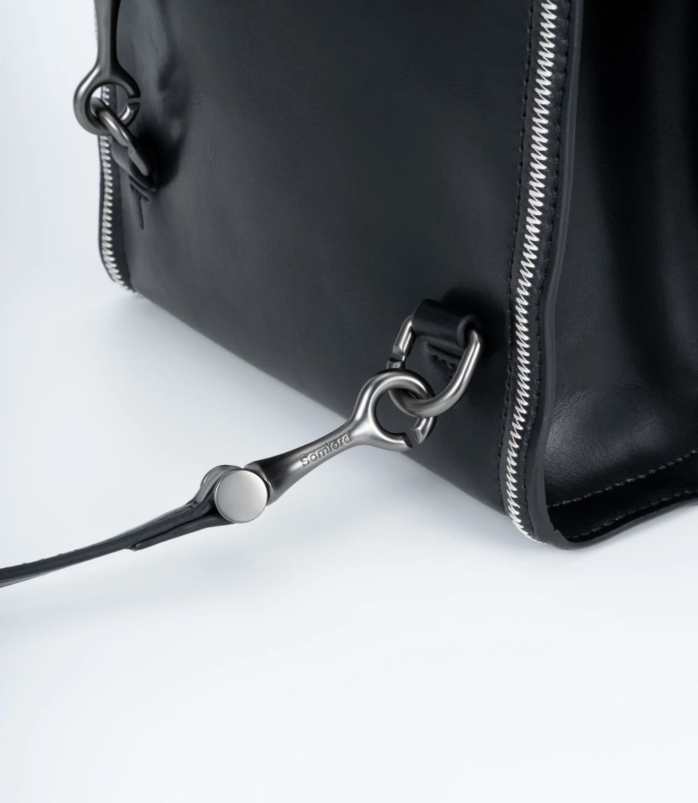 Secure and stylish hardware – durable metal accents on the Convertible Leather Mini Backpack for added luxury.