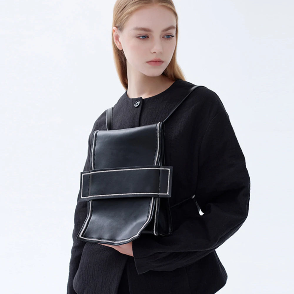 Fashion-forward and functional – Leather Mini Backpack styled as a statement crossbody accessory.
