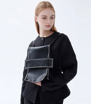 Fashion-forward and functional – Leather Mini Backpack styled as a statement crossbody accessory.