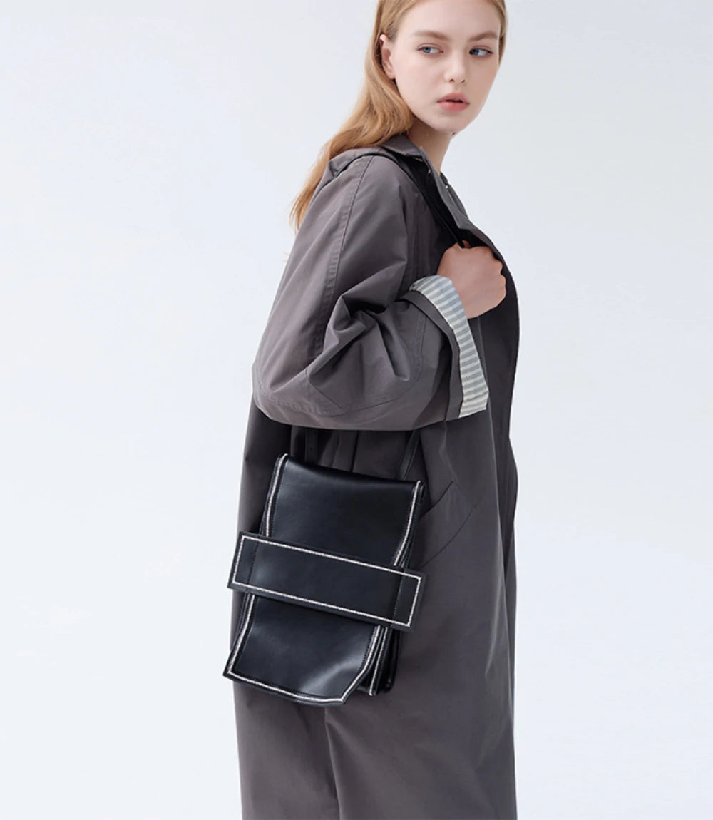 Minimalist convertible backpack – versatile for both casual and sophisticated styling with a structured silhouette.