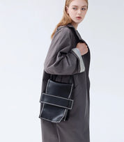 Minimalist convertible backpack – versatile for both casual and sophisticated styling with a structured silhouette.
