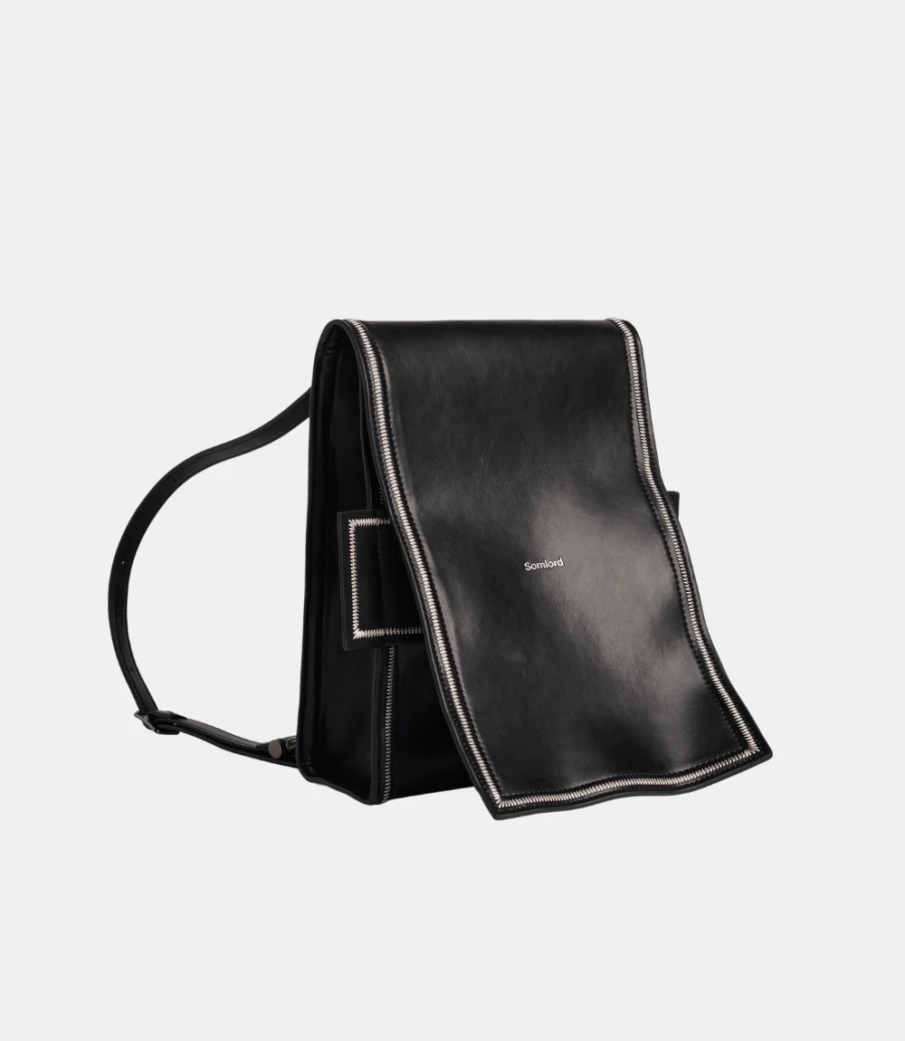Foldable Leather Mini Backpack – innovative design allowing transformation into a structured handbag or compact backpack.
