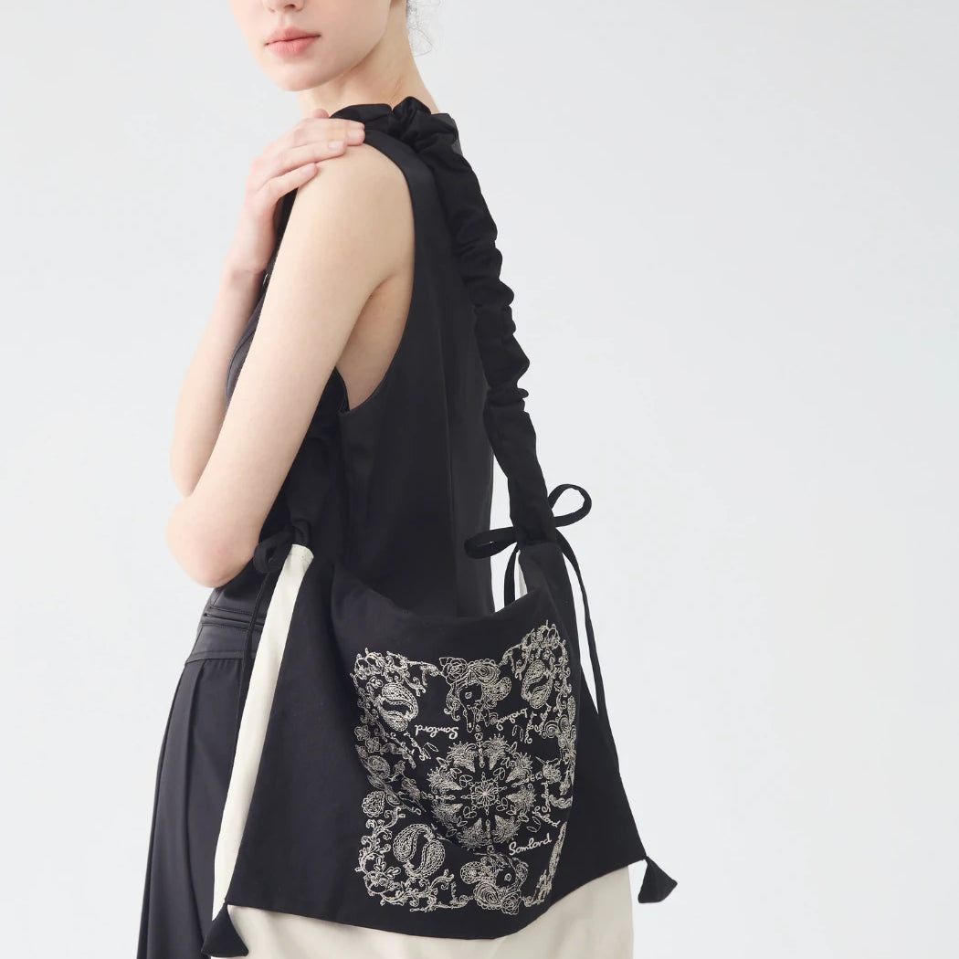 Back view of the Artistic Embroidered Crossbody Bag – slouchy shape with ruched strap detail for comfortable everyday wear.