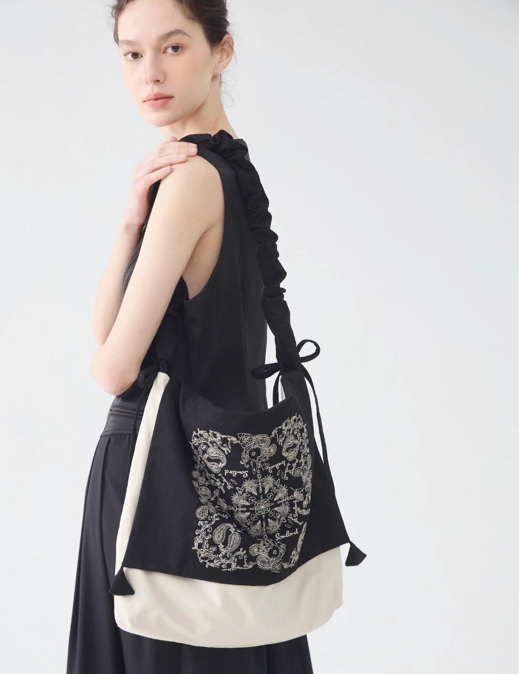 Back view of the Artistic Embroidered Crossbody Bag – slouchy shape with ruched strap detail for comfortable everyday wear.