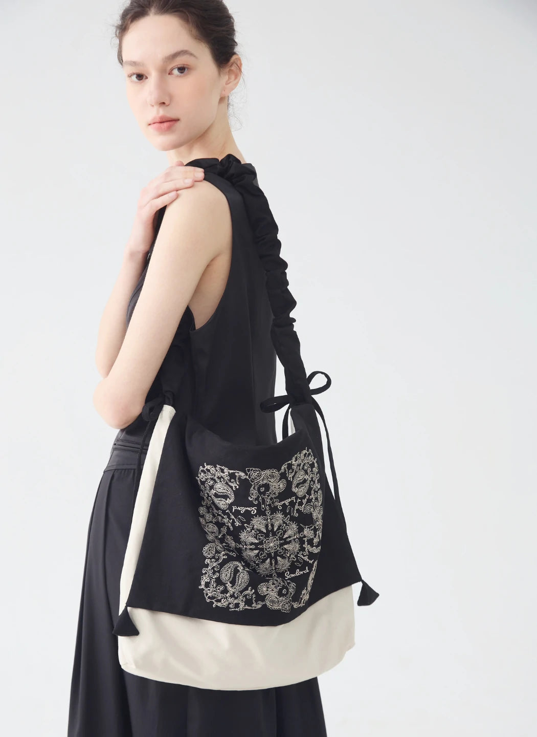 Back view of the Artistic Embroidered Crossbody Bag – slouchy shape with ruched strap detail for comfortable everyday wear.