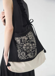 Elegant black and white Slouchy Embroidered Crossbody Bag – lightweight and versatile, designed for casual and chic styling.