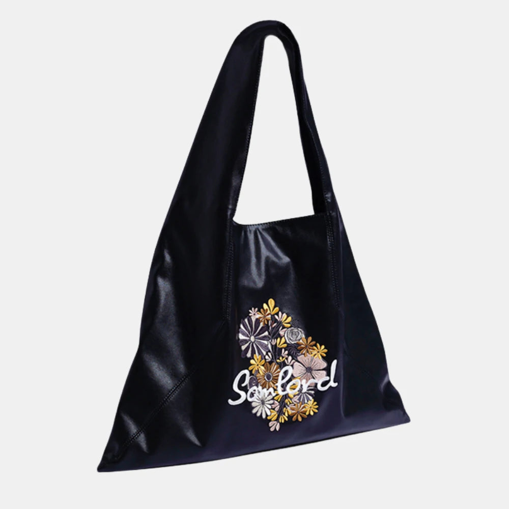 Artistic Embroidered Triangle Soft Leather Tote Bag – black leather tote with intricate floral embroidery, designed for modern elegance.