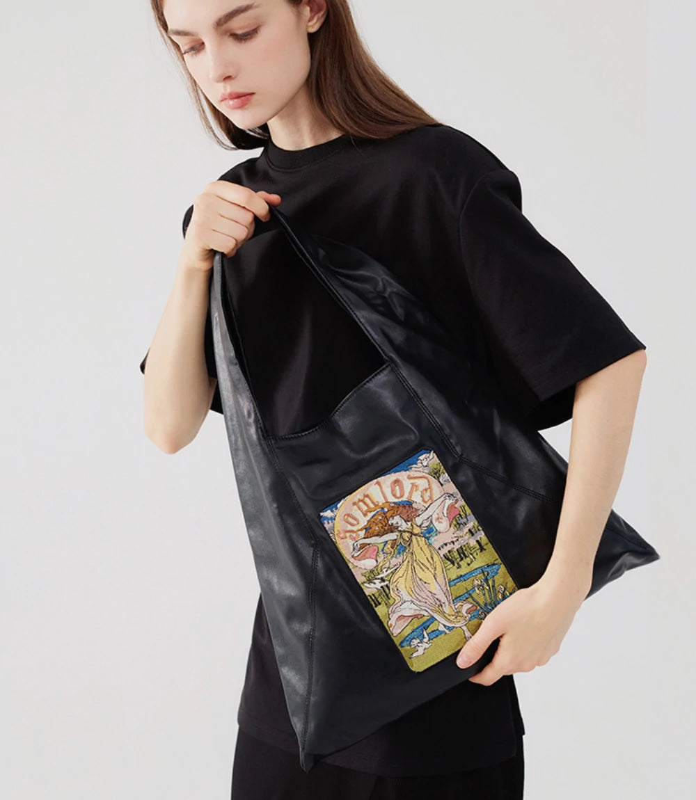 Convenient and stylish – easy-access open tote with an artistic embroidered design, blending aesthetics and practicality.