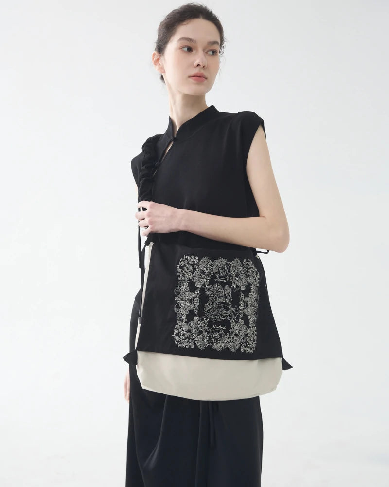 Somlord Artistic Slouchy Embroidered Crossbody Bag showcased against a clean white backdrop, highlighting the bag's detailed embroidery and premium craftsmanship, suitable for versatile styling.