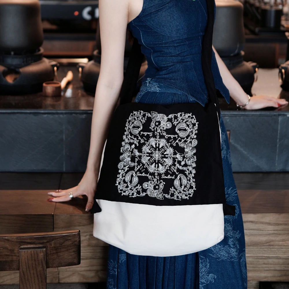 Close-up of Somlord Artistic Slouchy Embroidered Crossbody Bag, showcasing detailed artistic embroidery, premium fabric, and a versatile crossbody design for modern sophistication.