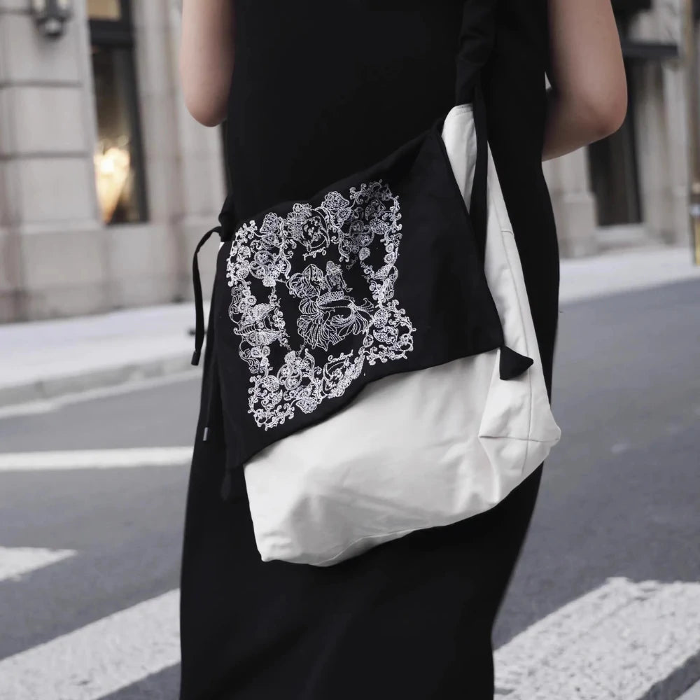 Somlord Artistic Slouchy Embroidered Crossbody Bag in motion on a busy city street, featuring intricate embroidery details and a stylish crossbody silhouette.