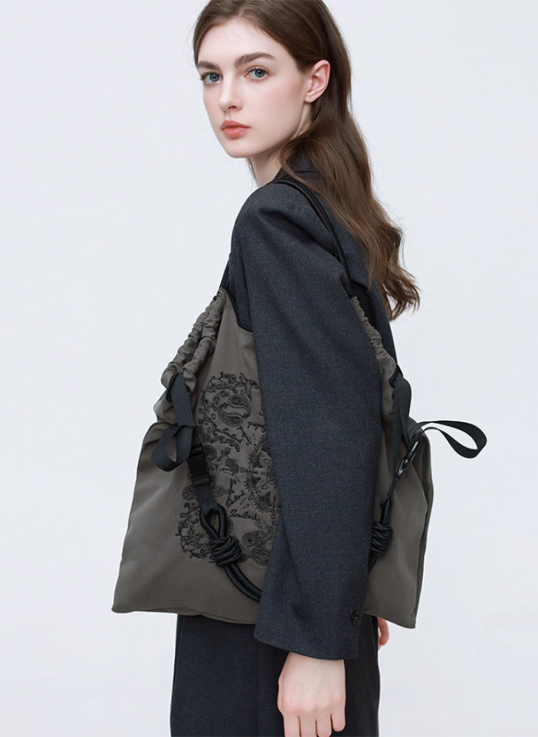 Dark gray Paisley Embroidered Tote worn over the shoulder – soft, lightweight, and ideal for casual and workwear styling.