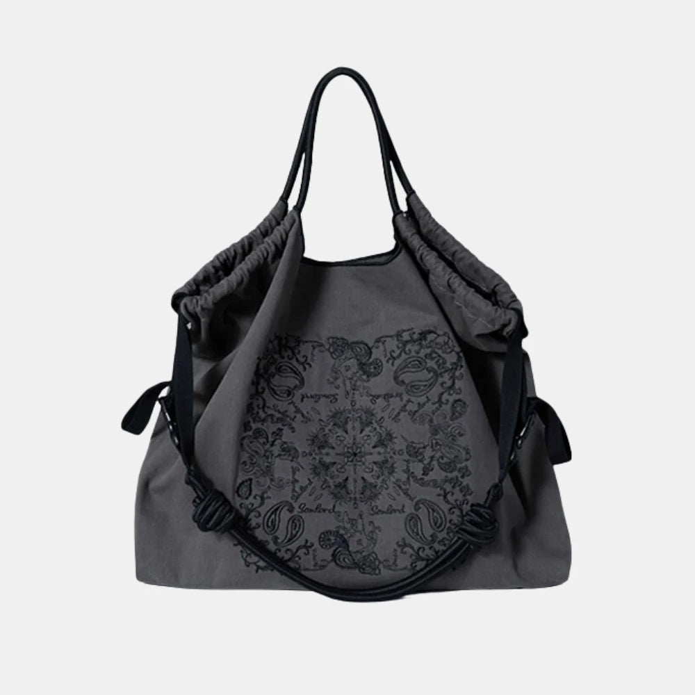 Paisley Embroidered Crossbody Tote Bag in dark gray – stylish and spacious tote with intricate embroidery and a soft, collapsible structure.