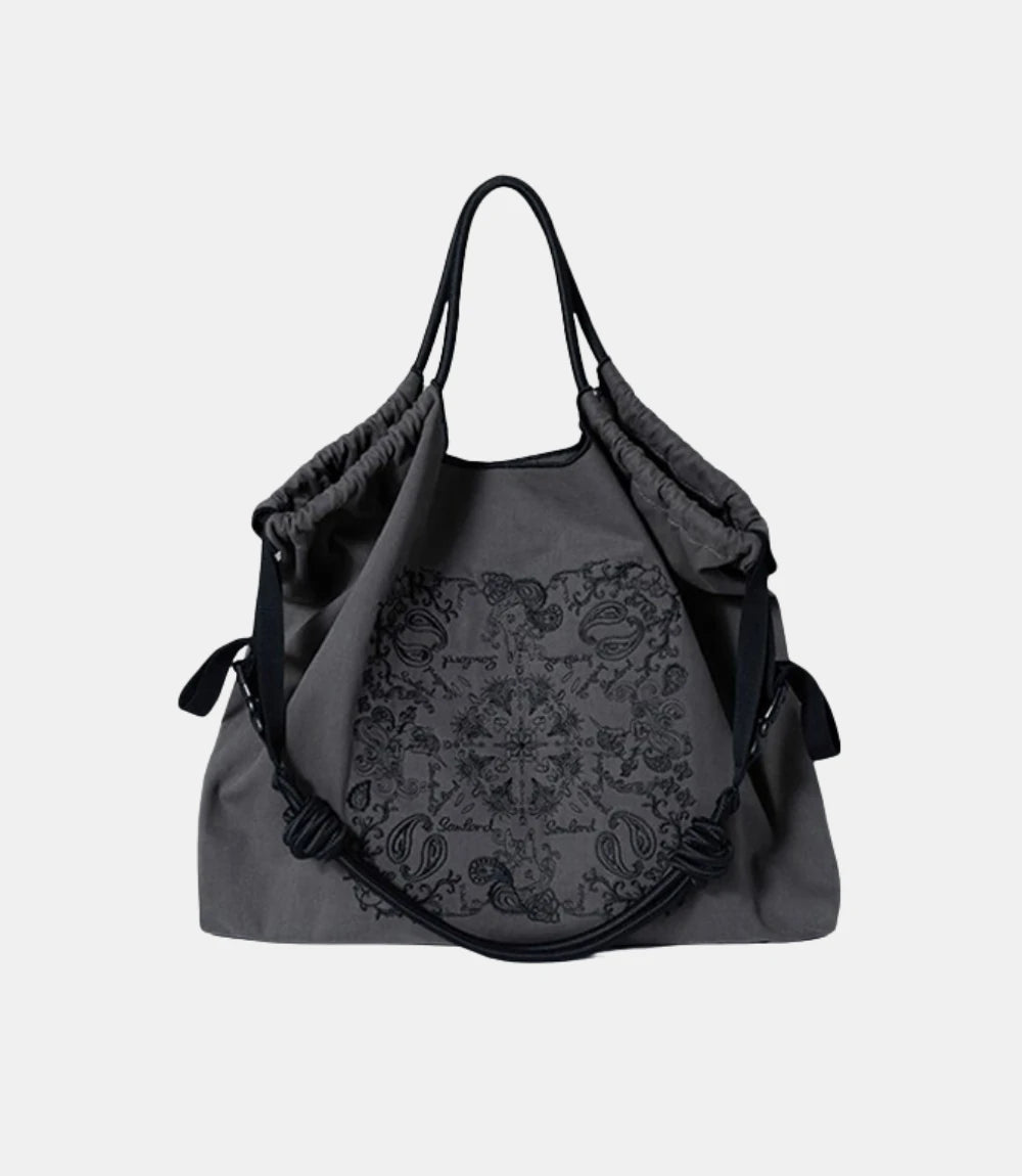 Paisley Embroidered Crossbody Tote Bag in dark gray – stylish and spacious tote with intricate embroidery and a soft, collapsible structure.