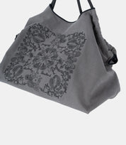 Artistic embroidery details on the Paisley Embroidered Tote – showcasing the structured yet flexible fabric for daily use.