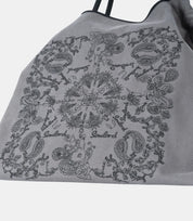 Intricate paisley embroidery on the crossbody tote – fine craftsmanship on soft, durable fabric, adding a vintage aesthetic.