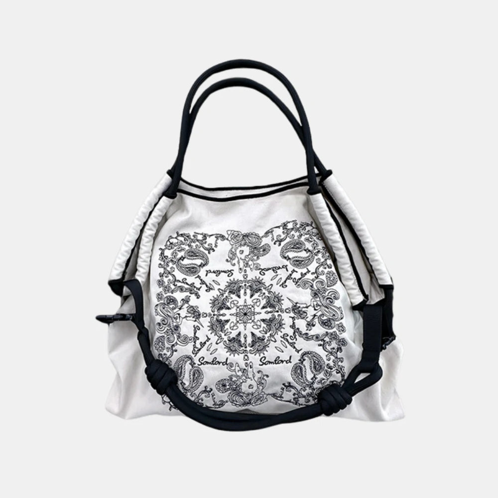 Minimalist White Paisley Embroidered Tote Bag – a versatile crossbody tote with a boho-inspired paisley embroidery pattern.