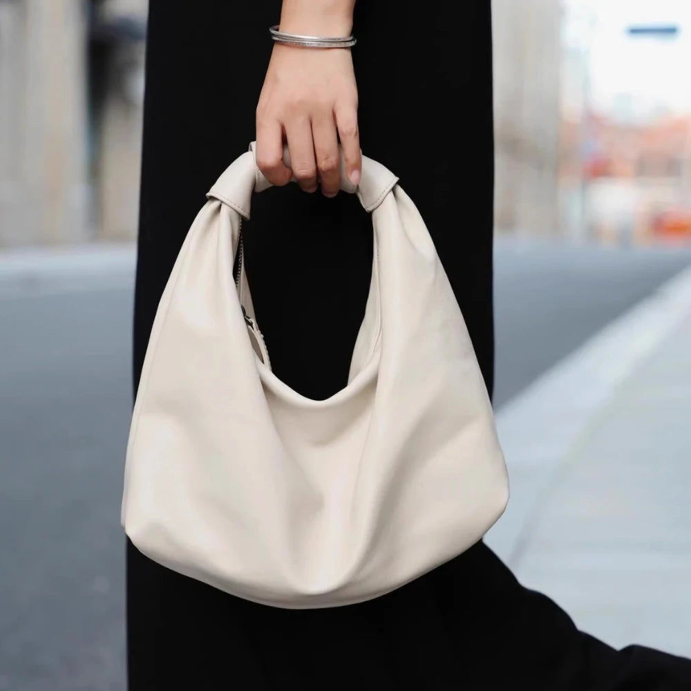 Somlord White Leather Cloud Hobo Bag – Model holding a stylish white leather hobo bag with soft curves, designed for casual and elegant outings.