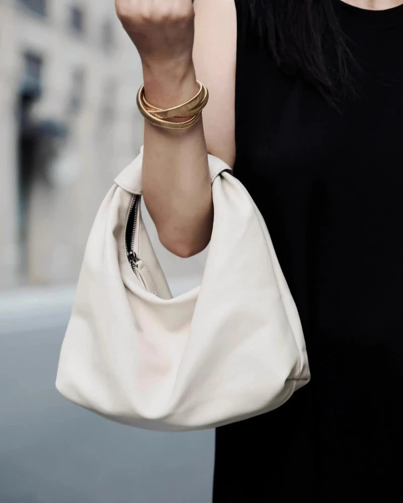 Somlord Retro Slouchy Leather Cloud Hobo Bag – Model holding a soft white leather hobo bag, minimalist design, perfect for casual chic and daily styling.