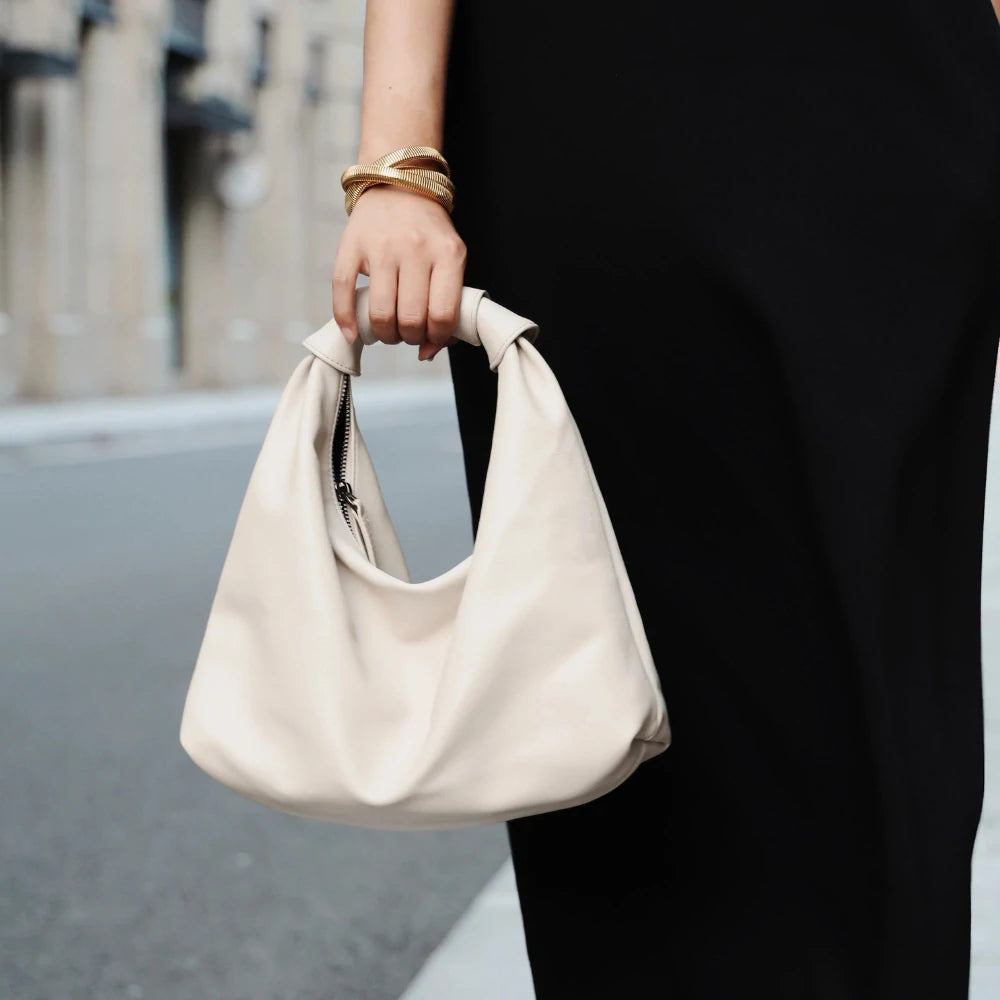 Somlord Retro Slouchy Leather Cloud Hobo Bag – Model showcasing a cream white soft leather hobo bag, versatile for daily wear and minimalist fashion.