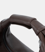 Detailed stitching on leather handle – a luxurious blend of soft leather, modern minimalism, and comfortable, functional design.