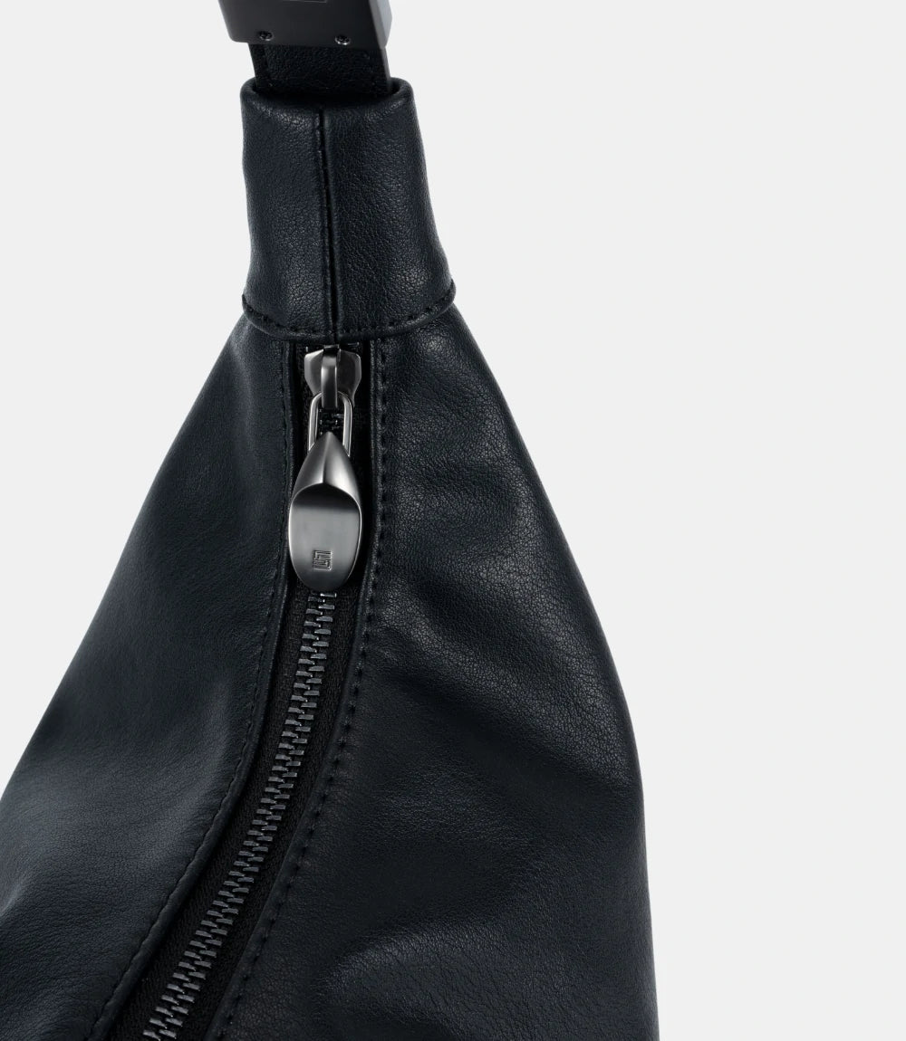 Close-up of reinforced hand-stitched leather handle – ensuring long-lasting wearability of the Cloud Hobo Bag.