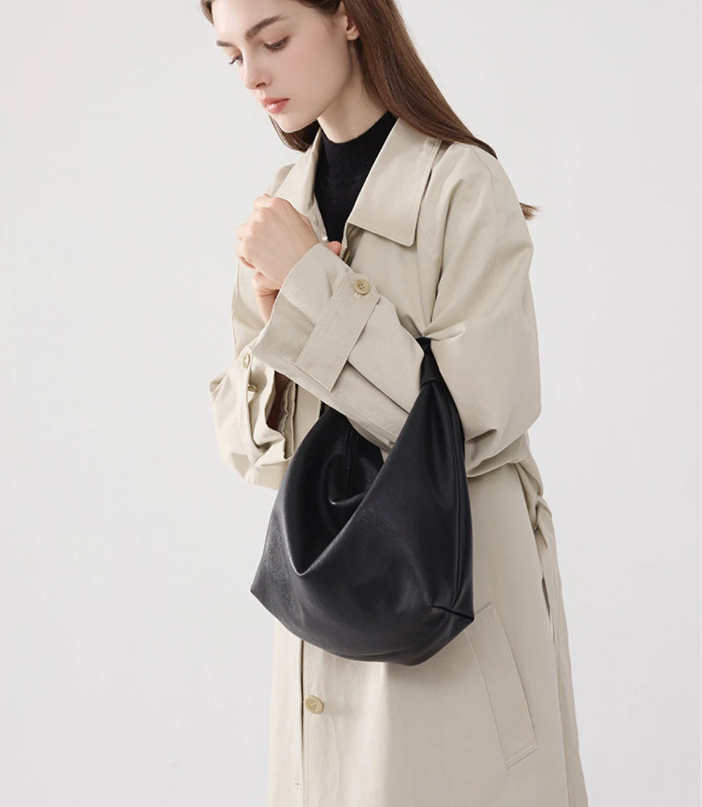 Casual yet stylish – The off-white Slouchy Leather Hobo Bag worn over the shoulder, blending softness with modern design.