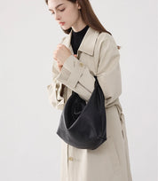 Casual yet stylish – The off-white Slouchy Leather Hobo Bag worn over the shoulder, blending softness with modern design.