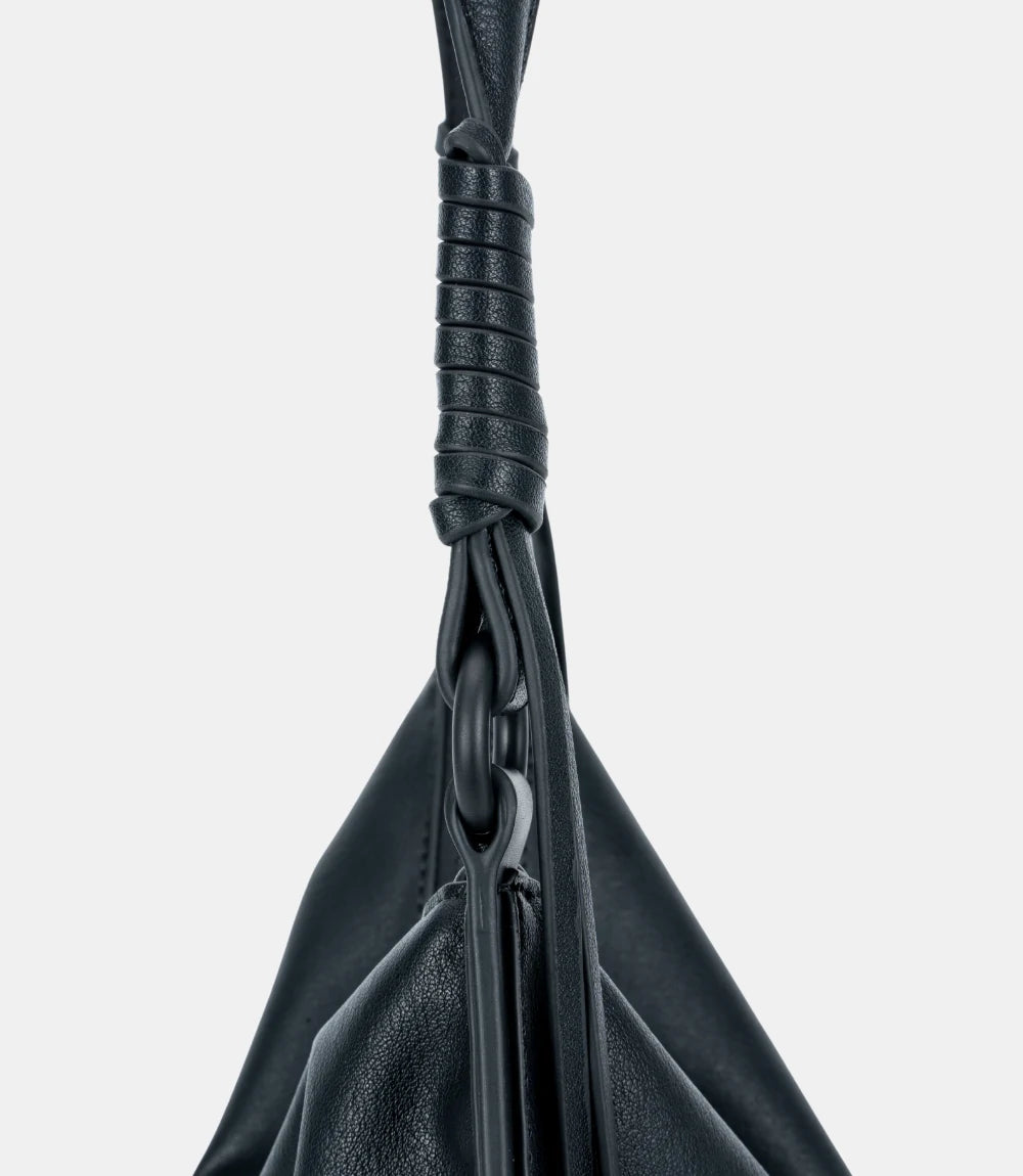 Adjustable shoulder strap detail – high-quality leather with reinforced stitching for durability and comfort.