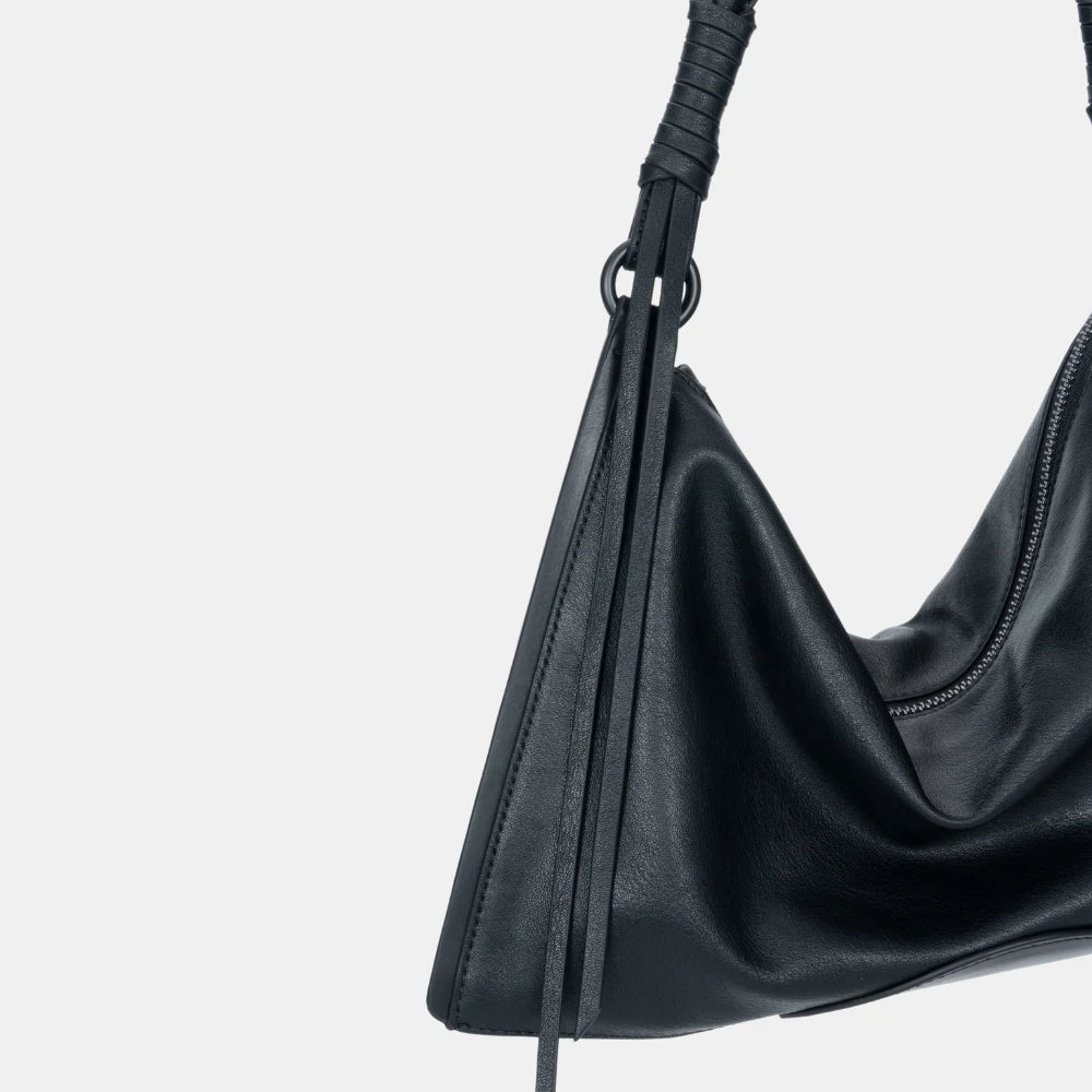 Side profile of the ChicCurve Leather Shoulder Bag – structured yet flexible, designed for stylish urban wear.