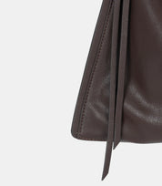 Adjustable shoulder strap detail – high-quality leather with reinforced stitching for durability and comfort.
