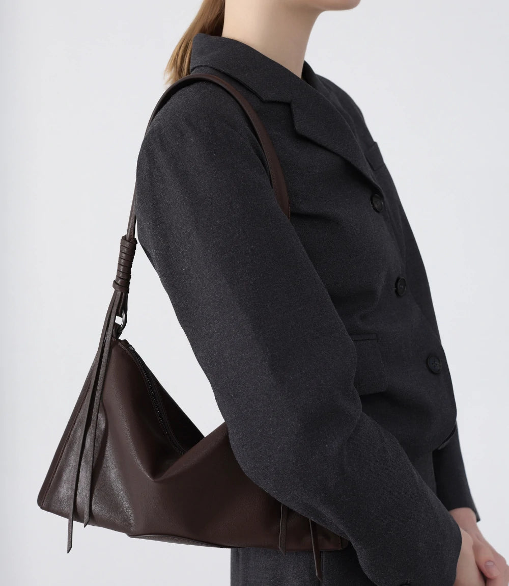 Versatile brown ChicCurve Leather Bag – ideal for pairing with neutral and monochrome outfits.