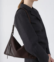 Versatile brown ChicCurve Leather Bag – ideal for pairing with neutral and monochrome outfits.