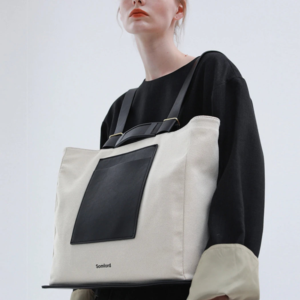 Versatile tote backpack – structured yet lightweight, seamlessly complementing modern fashion aesthetics.