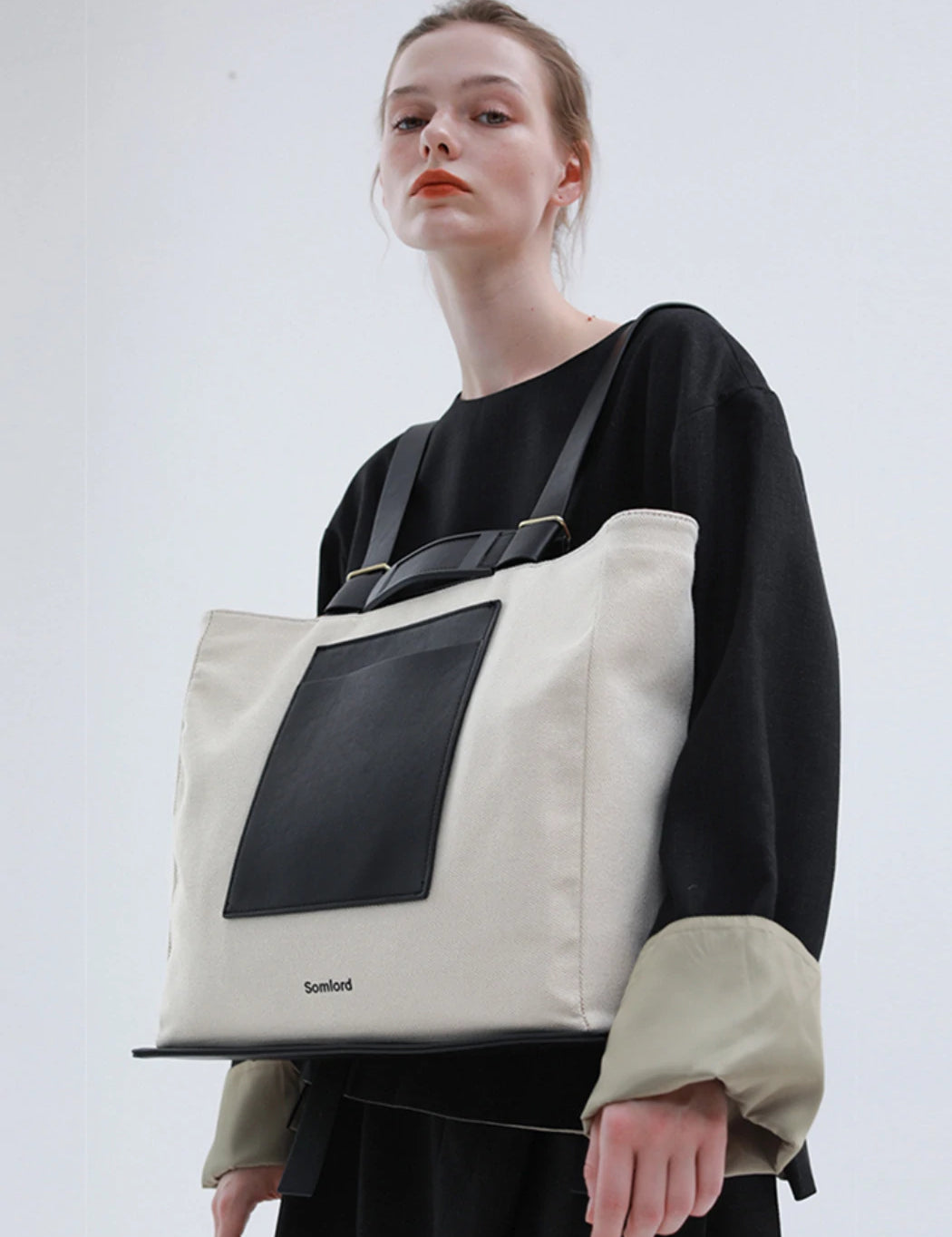 Versatile tote backpack – structured yet lightweight, seamlessly complementing modern fashion aesthetics.