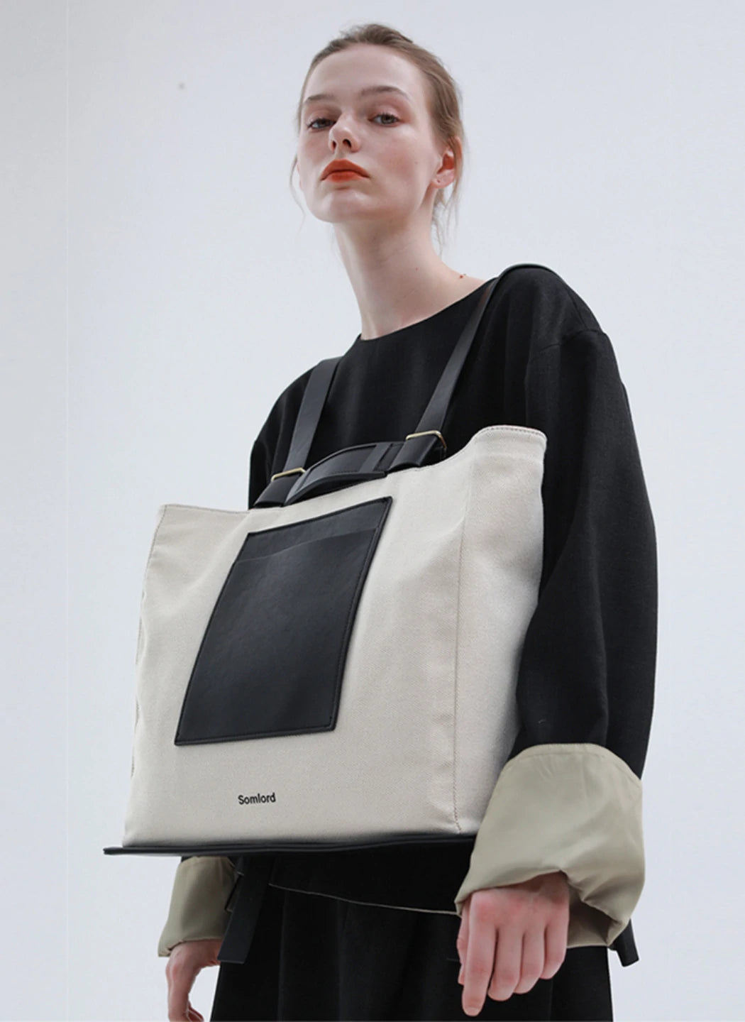 Versatile tote backpack – structured yet lightweight, seamlessly complementing modern fashion aesthetics.