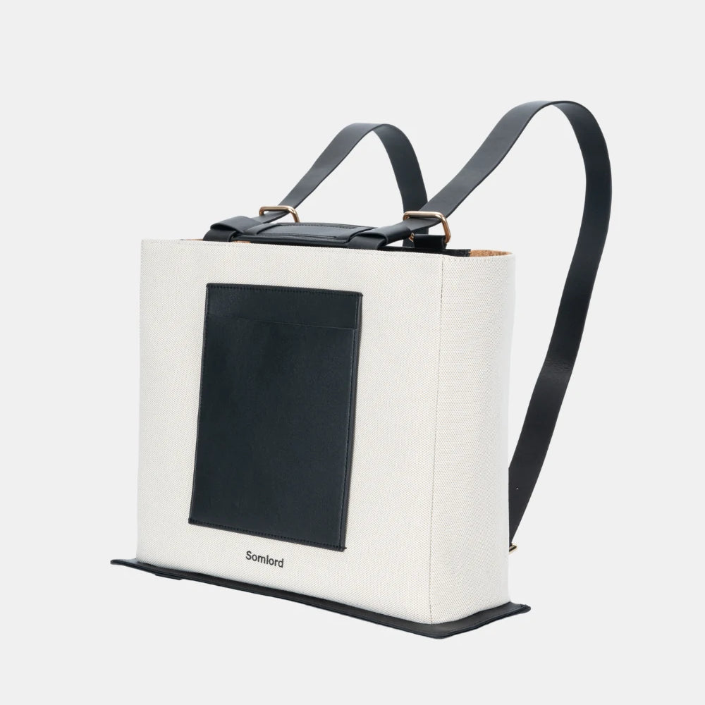 Urban Hybrid Canvas Structured Tote Backpack – modern two-tone design with a black front pocket and durable canvas construction.