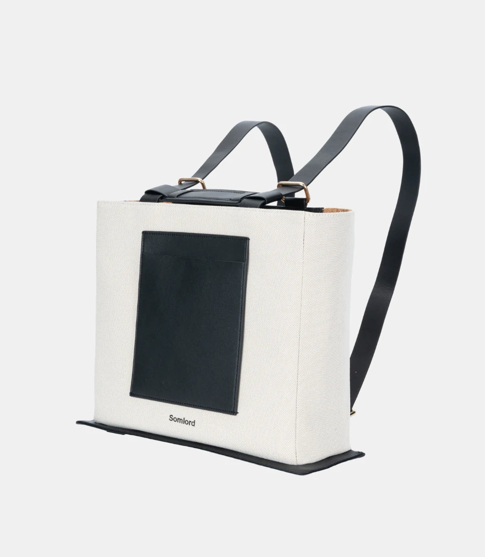 Urban Hybrid Canvas Structured Tote Backpack – modern two-tone design with a black front pocket and durable canvas construction.