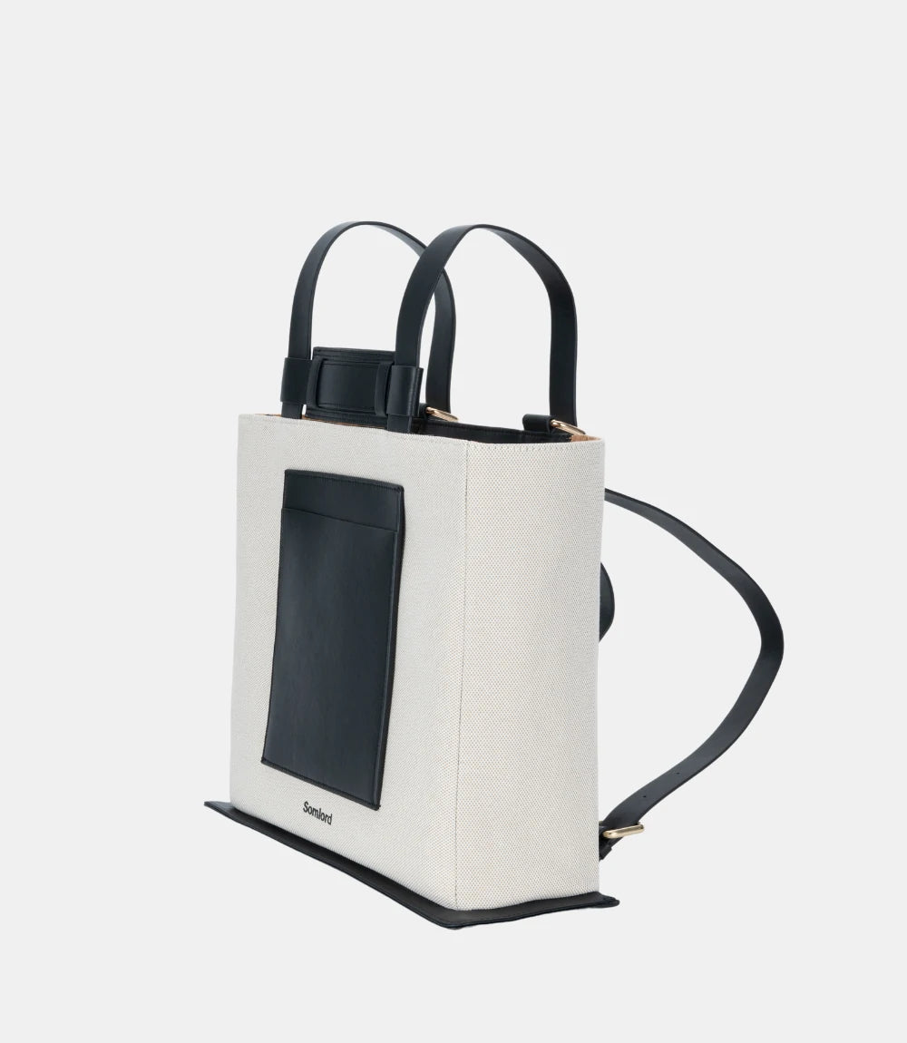 Convertible Canvas Structured Tote Backpack – featuring adjustable straps for both backpack and tote carrying options.